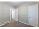 Bedroom with wood paneling and carpet flooring at 2812 Mitchell Dr, Decatur, GA 30032