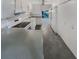 Well-equipped kitchen featuring white cabinetry and tile flooring at 3805 Stonewall Se Ter # 3805, Atlanta, GA 30339