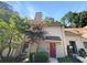 Townhouse exterior with red door and landscaping at 3805 Stonewall Se Ter # 3805, Atlanta, GA 30339