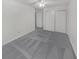 Bedroom with grey carpet and double closet at 3805 Stonewall Se Ter # 3805, Atlanta, GA 30339