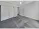 Bedroom with grey carpet and double closet at 3805 Stonewall Se Ter # 3805, Atlanta, GA 30339