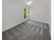 Well-lit bedroom with grey carpet and window at 3805 Stonewall Se Ter # 3805, Atlanta, GA 30339