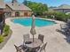 Inviting community pool with lounge chairs and a patio table at 11213 Brookhavenclub Dr, Johns Creek, GA 30097