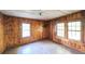 Simple bedroom with wood walls and floors at 2164 Five Points Rd, Waco, GA 30182