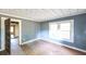 Empty bedroom with hardwood floors and gray walls at 2164 Five Points Rd, Waco, GA 30182