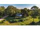 Aerial view of a ranch home nestled on a wooded lot at 2164 Five Points Rd, Waco, GA 30182
