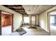 Unfinished living room with exposed beams and wood flooring at 2164 Five Points Rd, Waco, GA 30182