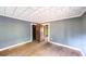 Empty bedroom with hardwood floors and gray walls, ready for customization at 2164 Five Points Rd, Waco, GA 30182