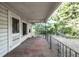 A wide front porch with an ornate railing at 2164 Five Points Rd, Waco, GA 30182