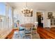 Charming breakfast nook with hardwood floors and a beautiful chandelier at 4068 Andover Cir, Mcdonough, GA 30252