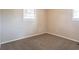 Simple carpeted bedroom with neutral walls and a window at 416 Macedonia Se Rd, Atlanta, GA 30354
