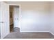 Bright bedroom with carpet, neutral walls, and access to other rooms at 416 Macedonia Se Rd, Atlanta, GA 30354