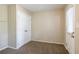 Spacious bedroom with neutral walls, carpet flooring, and ample closet space at 416 Macedonia Se Rd, Atlanta, GA 30354