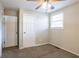 Spacious bedroom with neutral walls, carpet flooring, and two closets at 416 Macedonia Se Rd, Atlanta, GA 30354