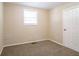 Simple bedroom with a window, closet, and neutral wall colors at 416 Macedonia Se Rd, Atlanta, GA 30354
