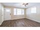 Living room featuring hardwood floors, neutral walls, and a ceiling fan at 416 Macedonia Se Rd, Atlanta, GA 30354