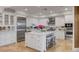 Modern kitchen with white cabinets, stainless steel appliances, and large island at 3286 Northside Nw Pkwy # 1005, Atlanta, GA 30327