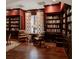 Library with built-in bookshelves, comfortable seating, and hardwood floors at 3286 Northside Nw Pkwy # 1005, Atlanta, GA 30327
