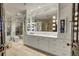 Modern bathroom with a large vanity and mirrored walls at 3286 Northside Nw Pkwy # 1005, Atlanta, GA 30327