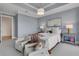 Main bedroom with sitting area, plush bedding, and city views at 1065 Peachtree Ne St # 3003, Atlanta, GA 30309