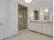 Spa-like bathroom with marble shower, double vanity and a decorative rug at 1065 Peachtree Ne St # 3003, Atlanta, GA 30309