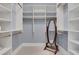 Spacious closet with ample shelving and a full-length mirror at 1065 Peachtree Ne St # 3003, Atlanta, GA 30309
