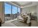 Bright bedroom with city views and comfy seating at 1065 Peachtree Ne St # 3003, Atlanta, GA 30309
