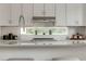 Modern kitchen with white cabinets, stainless steel appliances, and a large window at 2029 Memorial Dr # 33, Atlanta, GA 30317
