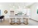 Modern kitchen with white cabinets, island with seating, and stainless steel appliances at 2029 Memorial Dr # 33, Atlanta, GA 30317