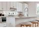 Modern kitchen with white cabinets, island with seating, and stainless steel appliances at 2029 Memorial Dr # 33, Atlanta, GA 30317