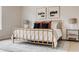 Bright bedroom with large window, hardwood floors, and gold bed frame at 2029 Memorial Dr # 33, Atlanta, GA 30317