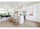Open concept kitchen with white cabinets, island, and dining area at 2029 Memorial Dr # 33, Atlanta, GA 30317