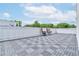 Rooftop deck with gray tile and wicker chairs at 2029 Memorial Dr # 33, Atlanta, GA 30317