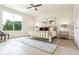 Spacious bedroom with large window, hardwood floors, and gold bed frame at 2029 Memorial Dr # 33, Atlanta, GA 30317