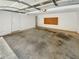 Spacious garage with overhead door and ample storage space at 353 River Point Dr, Mcdonough, GA 30252