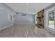Bright living room with hardwood floors, stone fireplace, and ample natural light at 4907 Wycliffe Sw Dr, Stone Mountain, GA 30087