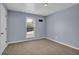 Well-lit bedroom with neutral walls and carpeting at 4907 Wycliffe Sw Dr, Stone Mountain, GA 30087