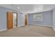 Bedroom features neutral walls, carpeting and access to a bath at 4907 Wycliffe Sw Dr, Stone Mountain, GA 30087