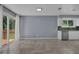 Living room with sliding glass doors to deck and kitchen views at 4907 Wycliffe Sw Dr, Stone Mountain, GA 30087