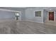 Open living room with hardwood floors and views into the kitchen and entry at 4907 Wycliffe Sw Dr, Stone Mountain, GA 30087