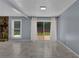 Spacious living room with sliding glass doors leading to a deck at 4907 Wycliffe Sw Dr, Stone Mountain, GA 30087