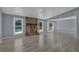 Living area with hardwood floors, stone fireplace and sliding glass doors to patio at 4907 Wycliffe Sw Dr, Stone Mountain, GA 30087