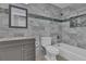 Updated bathroom with a tub, toilet and vanity at 4907 Wycliffe Sw Dr, Stone Mountain, GA 30087