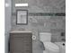 Updated bathroom features a gray vanity, tile shower, and a toilet at 4907 Wycliffe Sw Dr, Stone Mountain, GA 30087