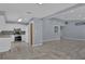 Open concept dining area with wood-look tile floor and kitchen view at 4907 Wycliffe Sw Dr, Stone Mountain, GA 30087
