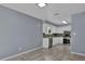 Open concept dining area with kitchen access and wood-look tile floor at 4907 Wycliffe Sw Dr, Stone Mountain, GA 30087
