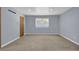 Spacious bedroom with neutral walls and carpeting at 4907 Wycliffe Sw Dr, Stone Mountain, GA 30087