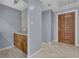 Basement wet bar with wood cabinets and granite countertop at 4907 Wycliffe Sw Dr, Stone Mountain, GA 30087