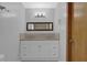 Bathroom boasts a double vanity with granite countertop at 4907 Wycliffe Sw Dr, Stone Mountain, GA 30087