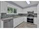 Updated kitchen with stainless steel appliances and granite countertops at 4907 Wycliffe Sw Dr, Stone Mountain, GA 30087
